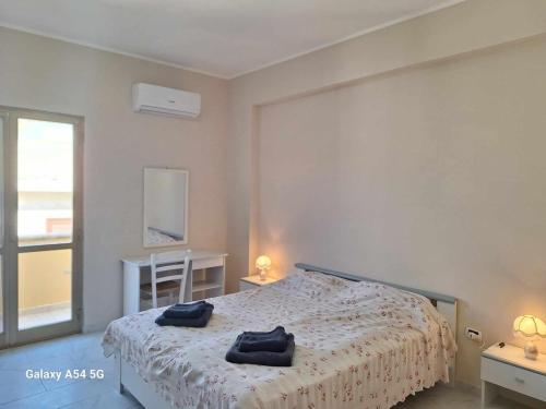 Ένα ή περισσότερα κρεβάτια σε δωμάτιο στο Diana Apartment Briatico