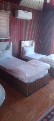 Кровать или кровати в номере Wadi Rum Sand moon Camp &Tour
