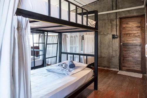 Postel nebo postele na pokoji v ubytování Moon Garden Hostel