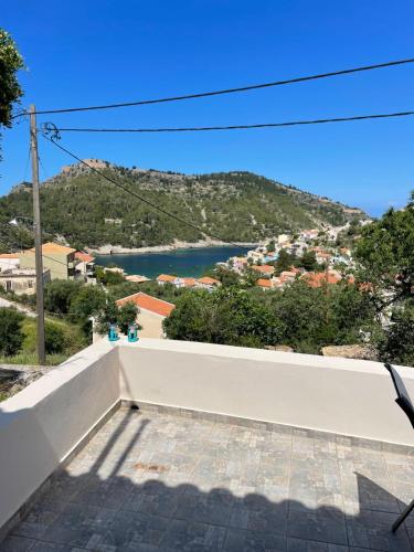 a view of a body of water from a white wall at Asos Terrace House in Asos