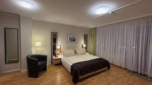 Postel nebo postele na pokoji v ubytování Hotel Windspiel