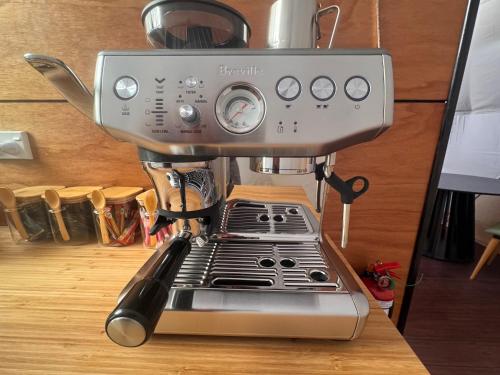 a coffee maker sitting on top of a table at Hanmer Glamping in Hanmer Springs