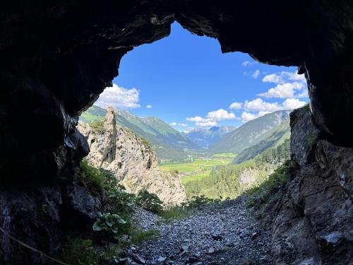 a view from a cave in a mountain range at Haus Carolus in Elbigenalp