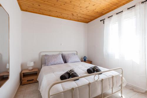 Ένα ή περισσότερα κρεβάτια σε δωμάτιο στο Mermaid Home