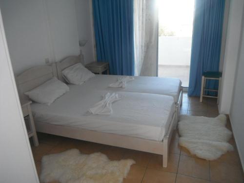 Postel nebo postele na pokoji v ubytování Mandorla Apartments