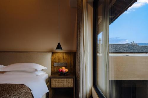 Katil atau katil-katil dalam bilik di Shaxi Fengyasong Village Hotel
