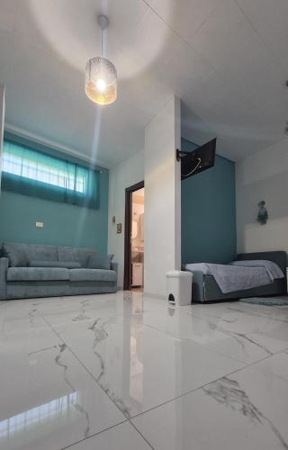 a living room with a couch and a bed at La piccola Dimora di Sara in Termoli