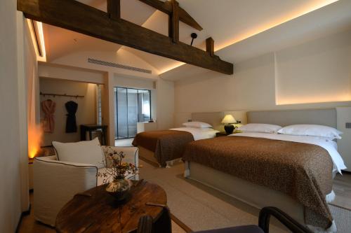 Katil atau katil-katil dalam bilik di Shaxi Fengyasong Village Hotel