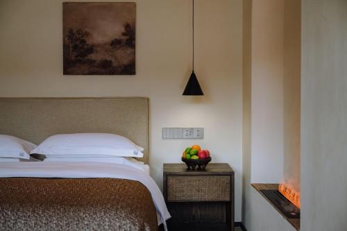 Katil atau katil-katil dalam bilik di Shaxi Fengyasong Village Hotel