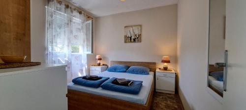 Posteľ alebo postele v izbe v ubytovaní Apartments Zara- ZD