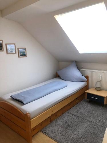 a bedroom with a bed in a attic at Siegen 1-4 Schlafplätze in Siegen