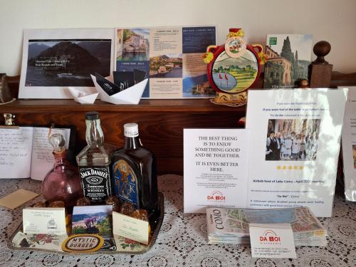 a table with bottles of alcohol and other items on it at Brunate98 in Como