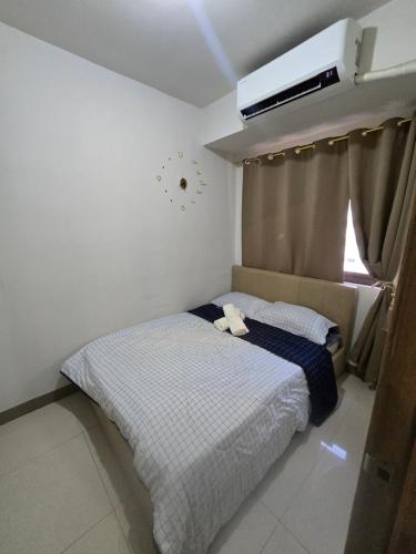 Postel nebo postele na pokoji v ubytování Sojourn in S Residences