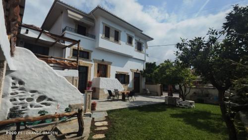 a view of the house from the yard at Orange Garden in Kala Nera