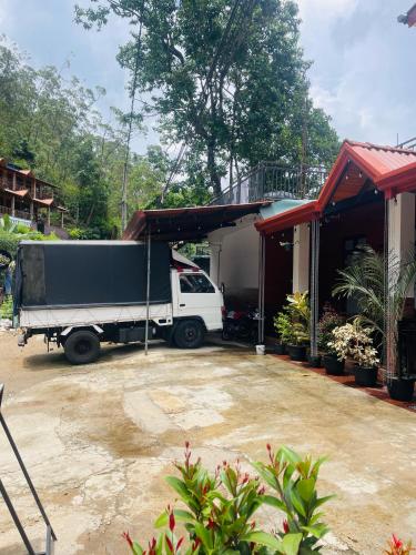 a truck parked outside of a house at sun mount adams peak in Adams Peak