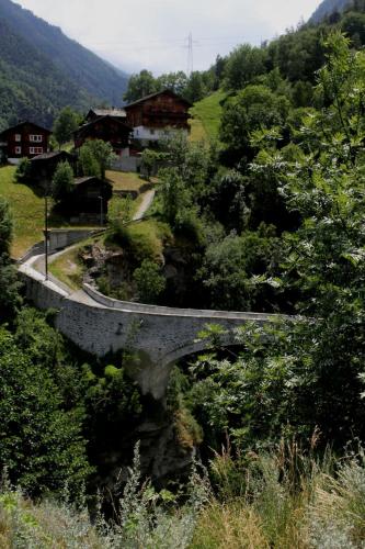 a bridge on a hill with a road at Chalet Chinegga in Stalden