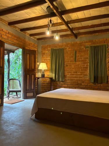 Una cama o camas en una habitación de Moss Forest Cabin Hike&River Escapes with veg meals