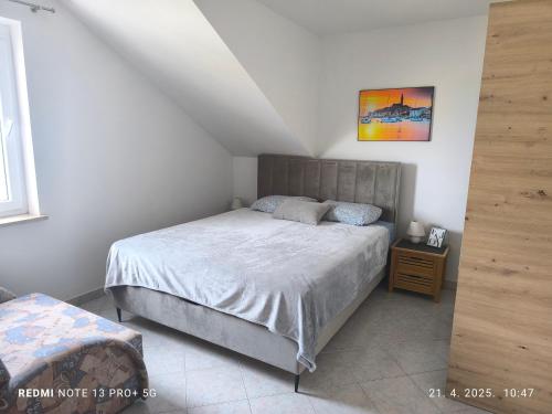 Postel nebo postele na pokoji v ubytování Apartments Erenda