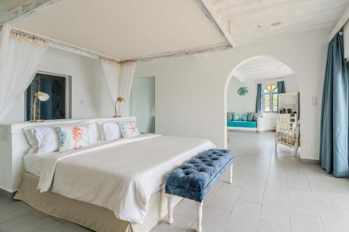 Ένα ή περισσότερα κρεβάτια σε δωμάτιο στο Chale Island Resort