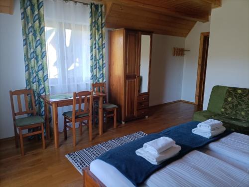 Postel nebo postele na pokoji v ubytování Mala Chatka
