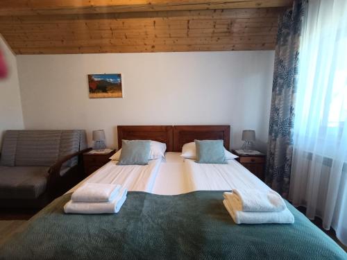 Postel nebo postele na pokoji v ubytování Mala Chatka