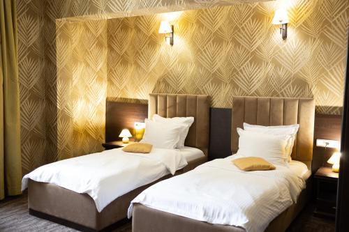 Postel nebo postele na pokoji v ubytování Hotel Neptun