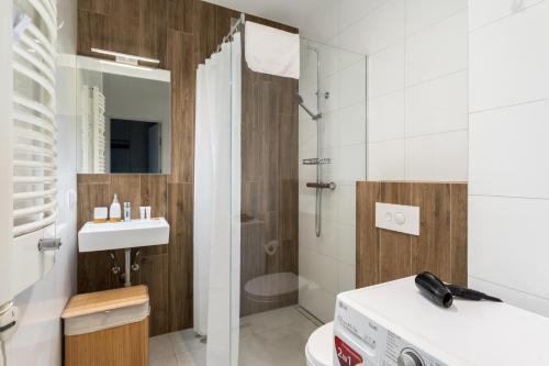 Ένα μπάνιο στο Jesionowa Homely Apartment with Garden