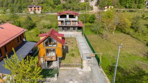 an overhead view of a house with a red roof at Zenilife Suit Apart & Bungalov in Ardeşen