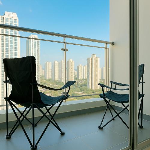two chairs sitting in front of a large window at E 2BR 60m2 Newly Built High Floor APT 2min to Hyundai Outlet Triple St 2Free Parking in Incheon