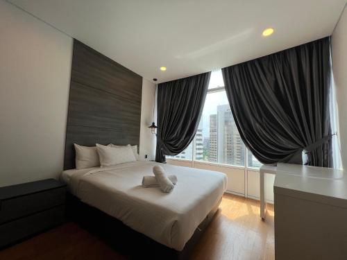Ένα ή περισσότερα κρεβάτια σε δωμάτιο στο Vortex Residence KLCC Bukit Bintang Kuala Lumpur