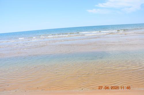 a sandy beach with the ocean in the background at Casa Vacanze Giorgia in Marinella di Selinunte