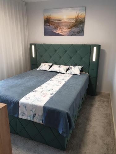 Postel nebo postele na pokoji v ubytování Piastowska 20A nr7, Balkon