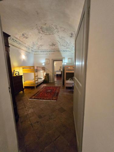 a hallway with a room with a ceiling at La Piscina nel Borgo in Bagnone
