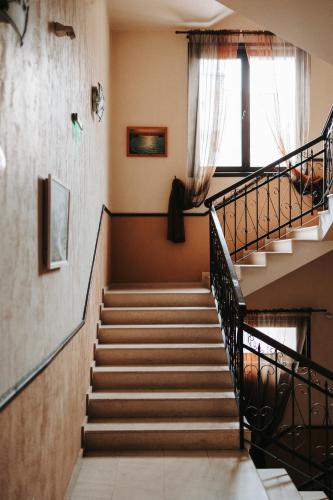 a set of stairs in a building with a window at Hotel Neptun in Vidin