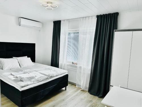 Postel nebo postele na pokoji v ubytování Katariina Apartments