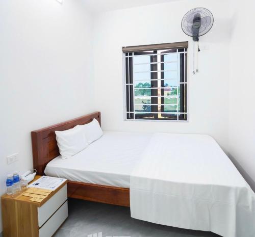 Postel nebo postele na pokoji v ubytování Hoàng Anh Hotel