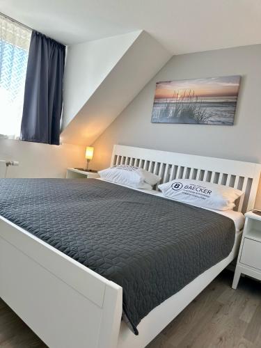 a bedroom with a large bed in a room at 7034 Enseling in Dahme