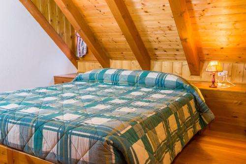 A bed or beds in a room at Agriturismo Pian dei Tass