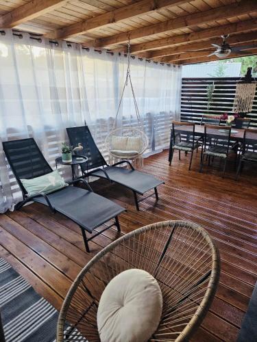 a room with chairs and a table and a dining room at Peponi Del Mar II in Biograd na Moru