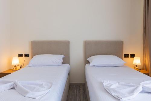 Ένα ή περισσότερα κρεβάτια σε δωμάτιο στο B Boutique Hotel
