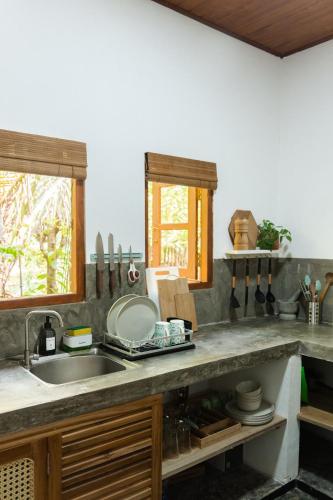 Kuchyň nebo kuchyňský kout v ubytování Podi Beach House Mawella