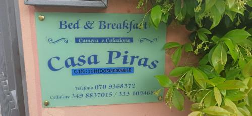 a sign for the bed and breakfast casa pizzas at B&B Casa Piras IUN3880 in Barùmini