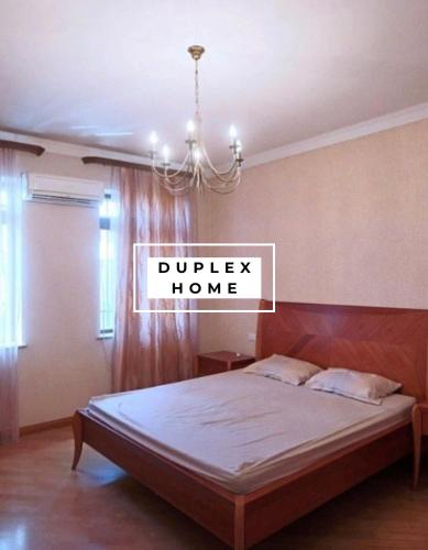 Tempat tidur dalam kamar di DUPLEX Home