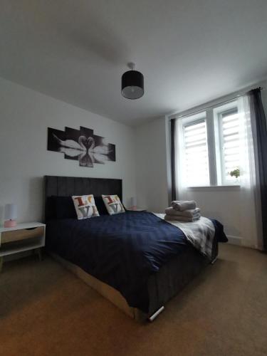 Postel nebo postele na pokoji v ubytování Stevenson Apartment in Oban City