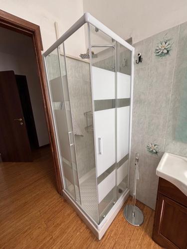a glass shower in a bathroom next to a sink at affittacamere Sestri Levante in Sestri Levante