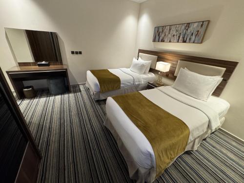 Katil atau katil-katil dalam bilik di Friesian Hotel Apartments