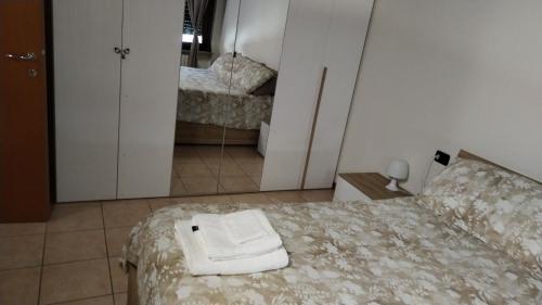 Postel nebo postele na pokoji v ubytování Apartment Artemisia - Cantù Centro