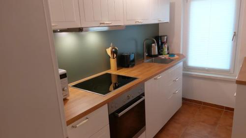 Dapur atau dapur kecil di Inselglück unter Reet 100m zum Strand - Garten & Privatterrasse - Hund willkommen