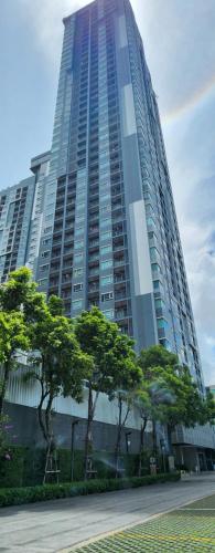 a tall building with trees in front of it at centric sea pattaya中心海 in Pattaya