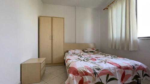 a bedroom with a bed and a cabinet and a window at Bledi's Apartment Spille in Spille